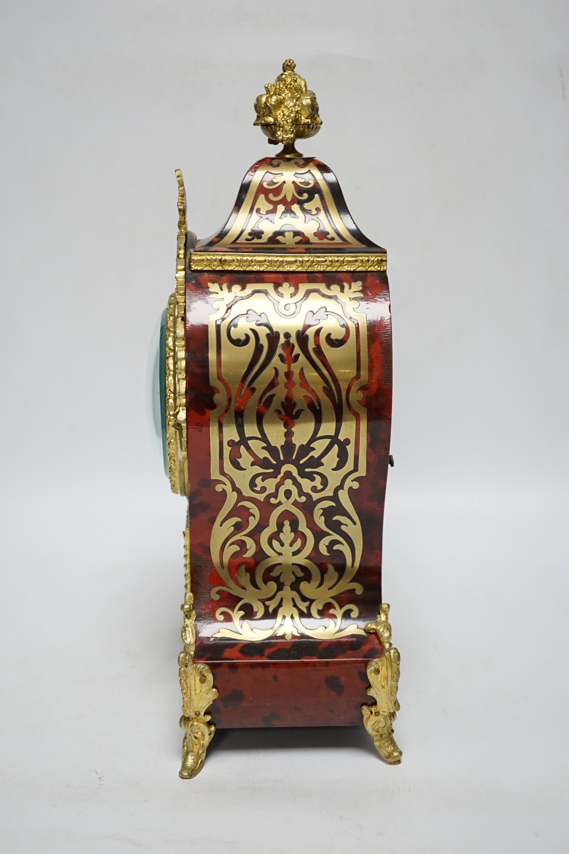 A French red boulle mantel clock, with French movement, striking on a coiled gong, height, 36cm